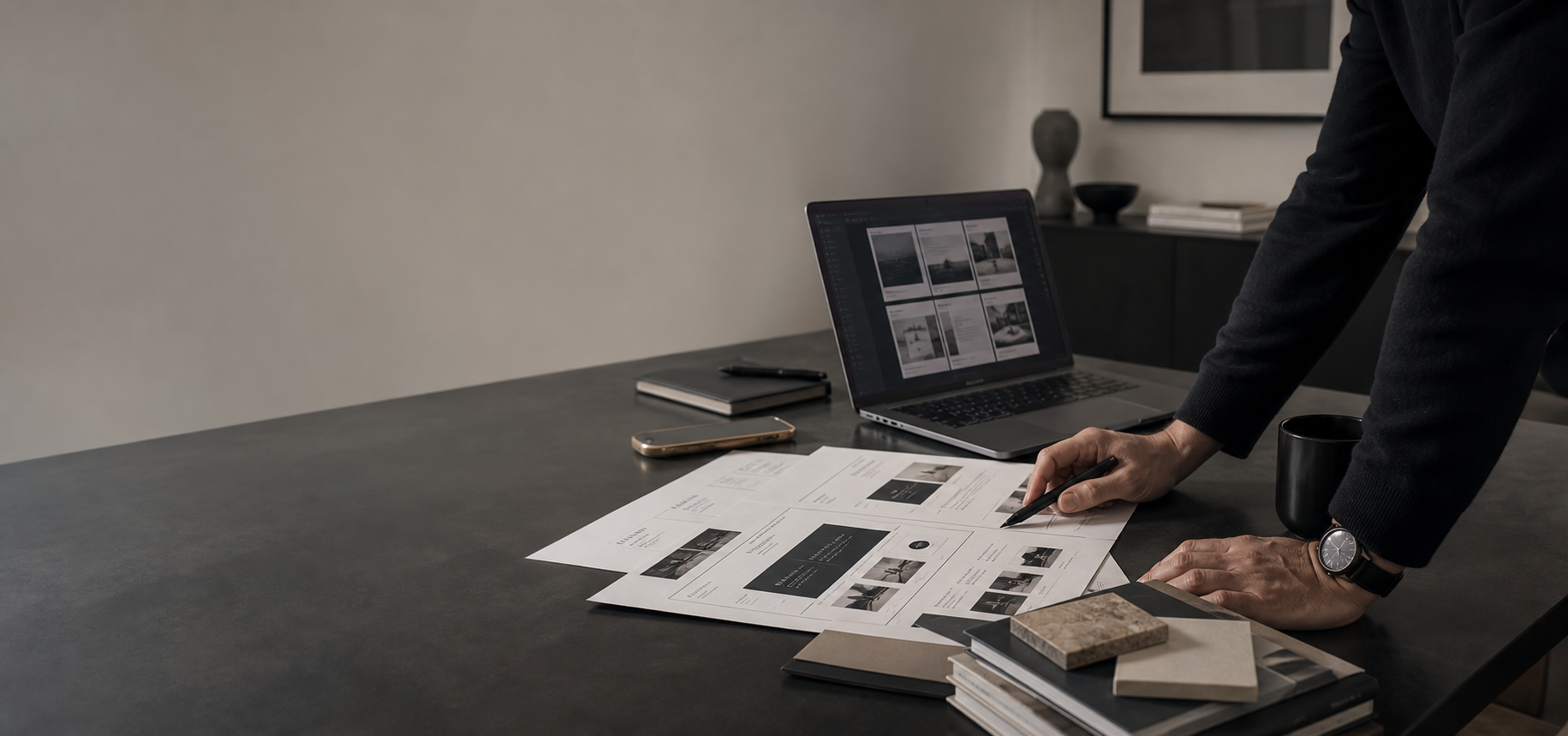 Editorial planning photograph showing a professional website delivery workflow with structured materials, roadmap documents, and premium workspace details.